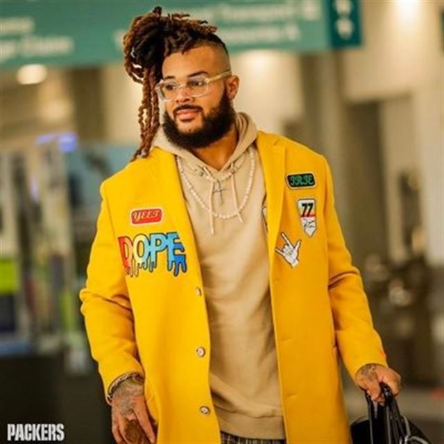 Green Bay Packers' Billy Turner wear a Crucial Catch headband as he leaves  the field following an NFL football game against the Atlanta Falcons,  Monday, Oct. 5, 2020, in Green Bay, Wis. (