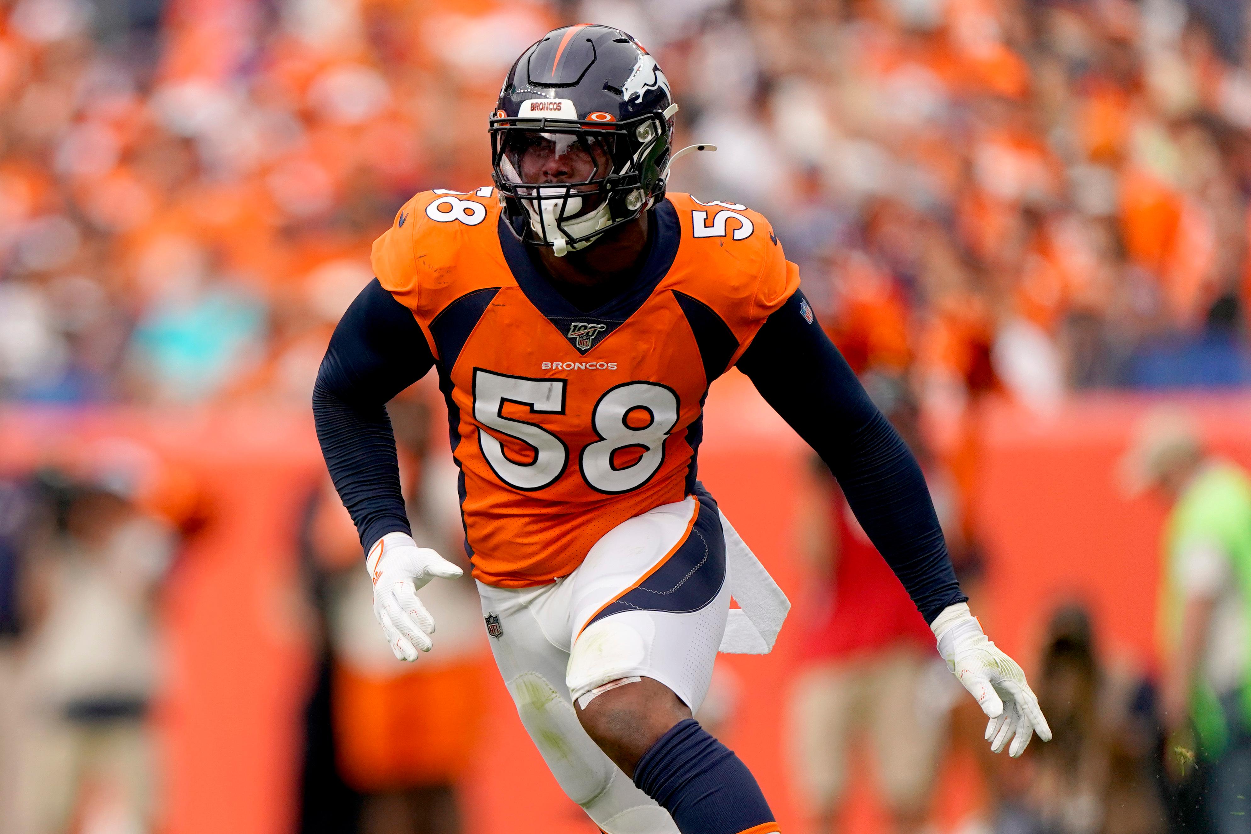 A dog wears the jersey of Denver Broncos outside linebacker Von Miller  before an NFL football game against the Tennessee Titans Sunday, Oct. 13,  2019, in Denver. (AP Photo/David Zalubowski Stock Photo 