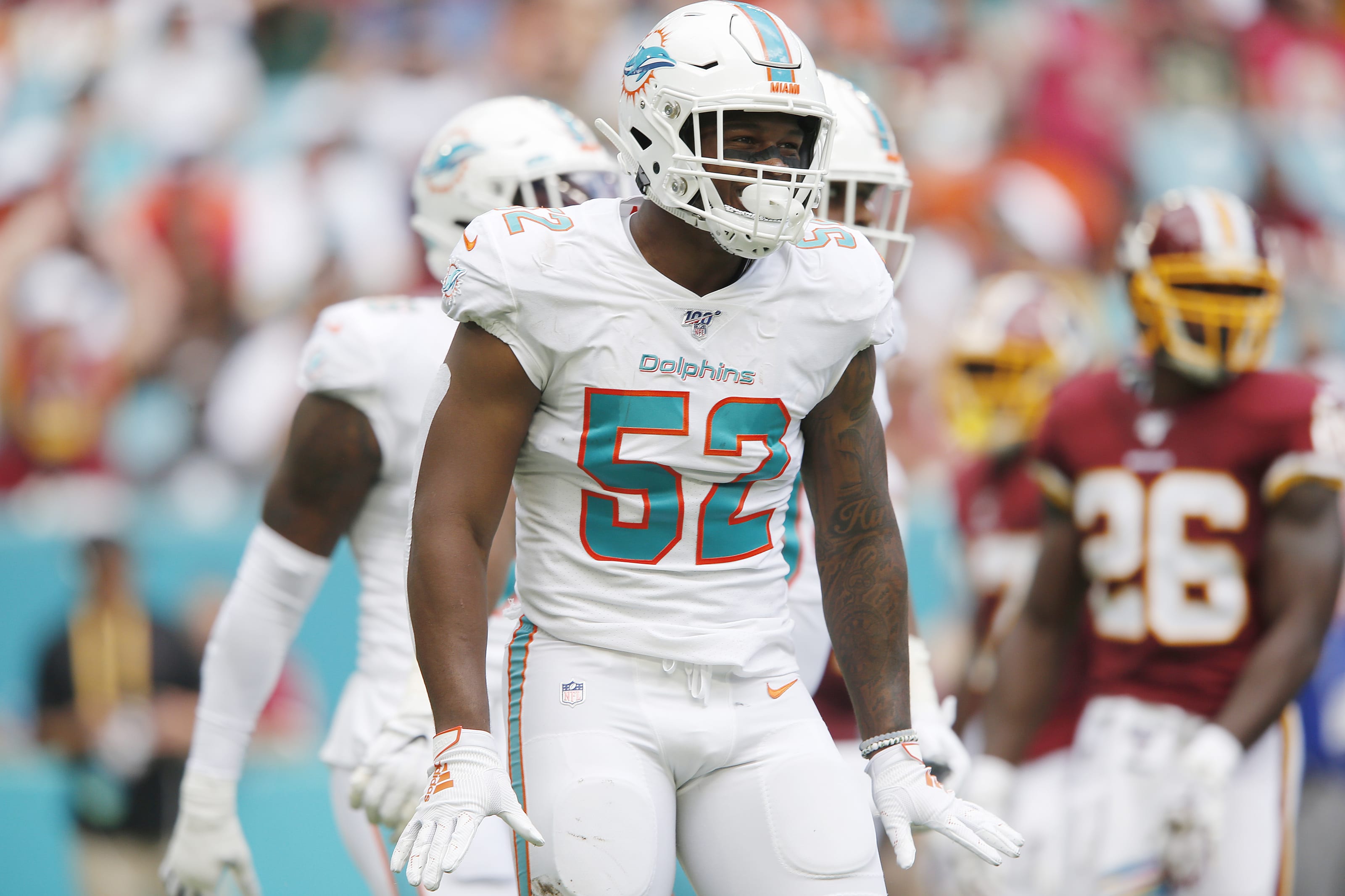 Miami Dolphins linebacker Raekwon McMillan (52) walks the sidelines, during  the second half of an NFL preseason football game against the Tampa Bay  Buccaneers, Thursday, Aug. 9, 2018, in Miami Gardens, Fla. (