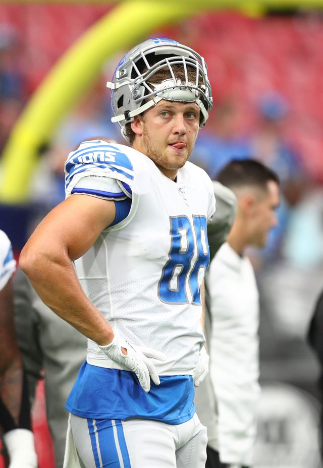 Iowa tight end T.J. Hockenson poses with his new team jersey after the  Detroit Lions selected Hockenson in the first round at the NFL football  draft, Thursday, April 25, 2019, in Nashville